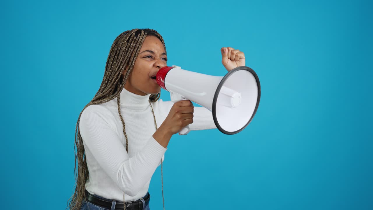 Determined Woman Shouting into Megaphone