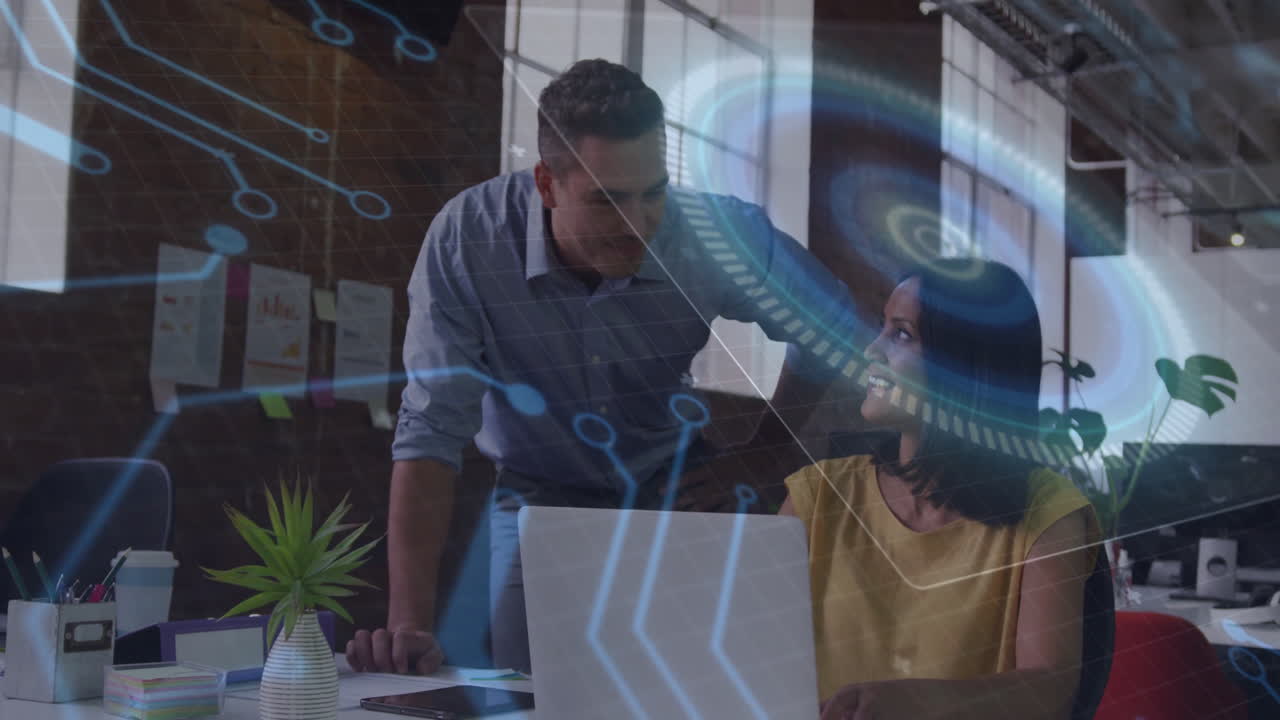 Discussing work at desk, business colleagues using digital animation interface