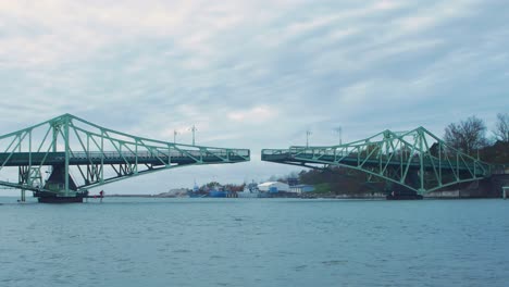 oskara kalpaka swing bridge closing in liepaja in cloudy autumn day, wide shot