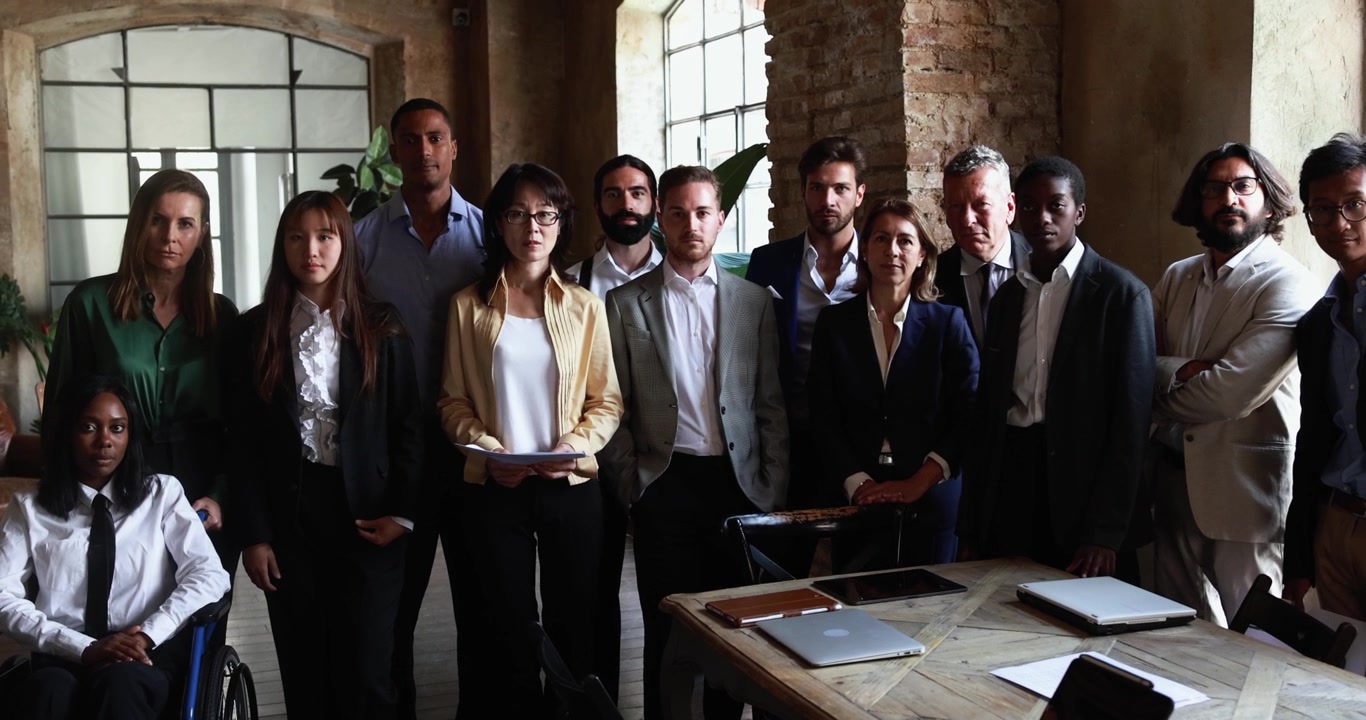 Diverse Group of Professionals Standing Together in Modern Office
