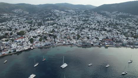 Drone-shot-of-Bodrum-town-with-boats-in-the-bay-on-the-Turkish-Riviera