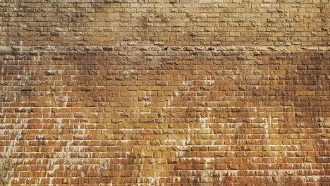 pedestal shot upwards as the drone flies above the dam's 297 ft masonry wall, over the top to reveal the reservoir on the other side at the new croton dam in westchester county, ny, on a cloudy day