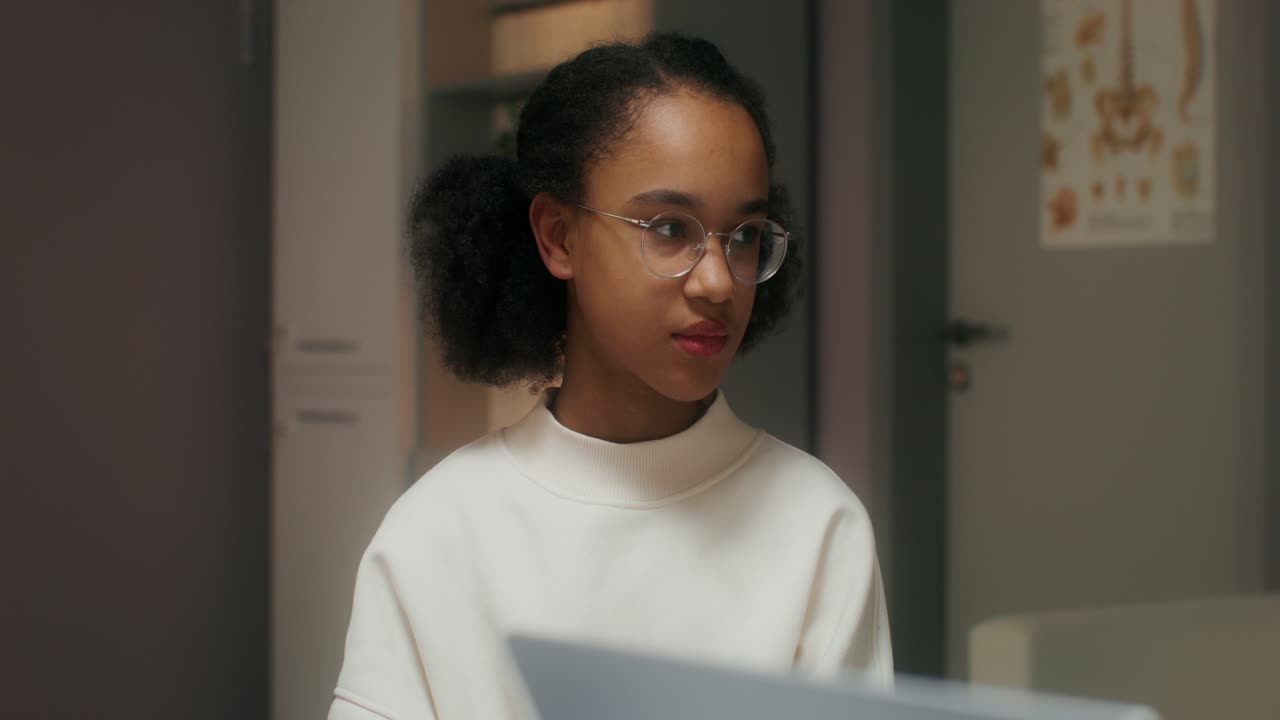 Teenage Girl Studying in a Medical Office