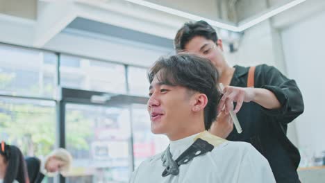 man getting haircut at salon