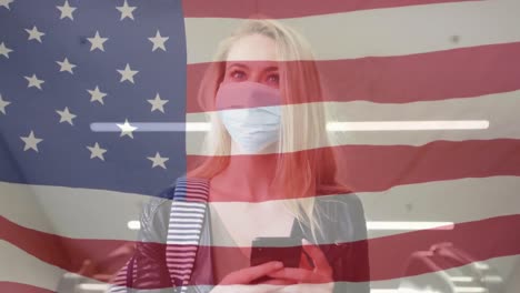 Animation-of-flag-of-usa-waving-over-woman-in-face-masks