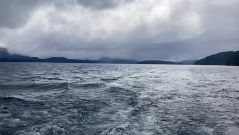 pov from ferry in lake nahuel huapi, villa la angostura, argentina