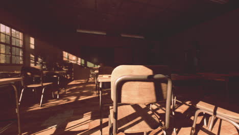 abandoned school classroom filled with shadows from late afternoon sunlight