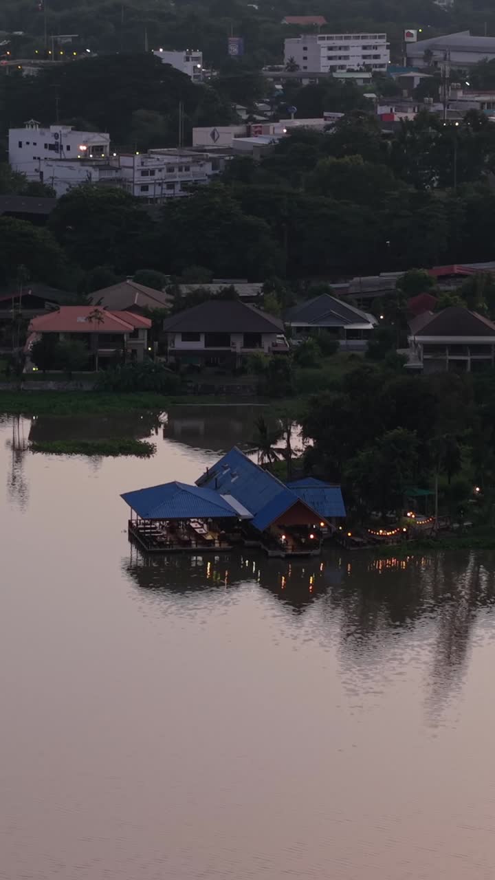 Cityscape View with Floating Restaurant on River
