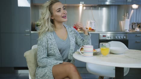 charming woman looking away during breakfast