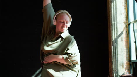 woman dancing indoors