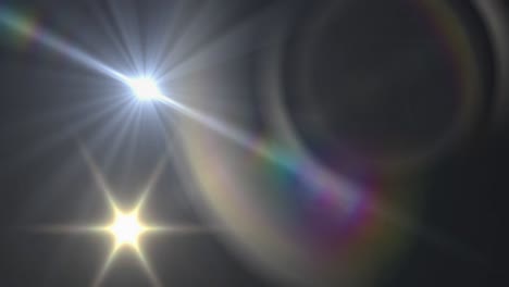 mancha de luz y destello de la lente contra un fondo negro