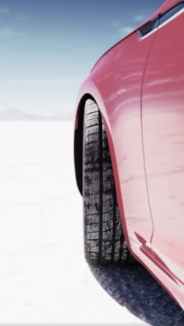 pink car on a salt flat