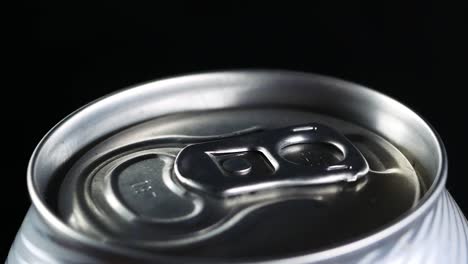 a cold drink rotates against a black background