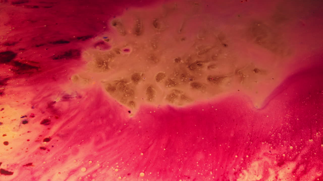 Colourful, organic, liquids macro shots buzzing and flowing