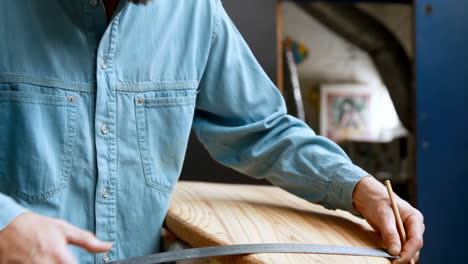 man making surfboard 4k