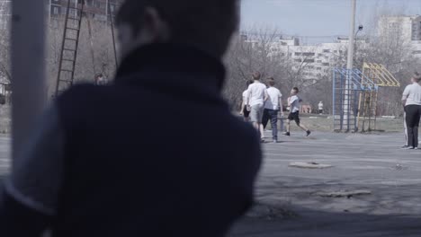 children playing basketball on an outdoor playground