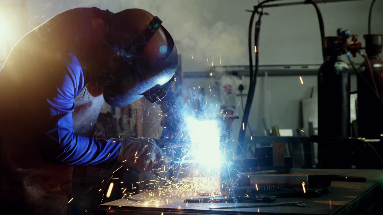 Welder welding a metal