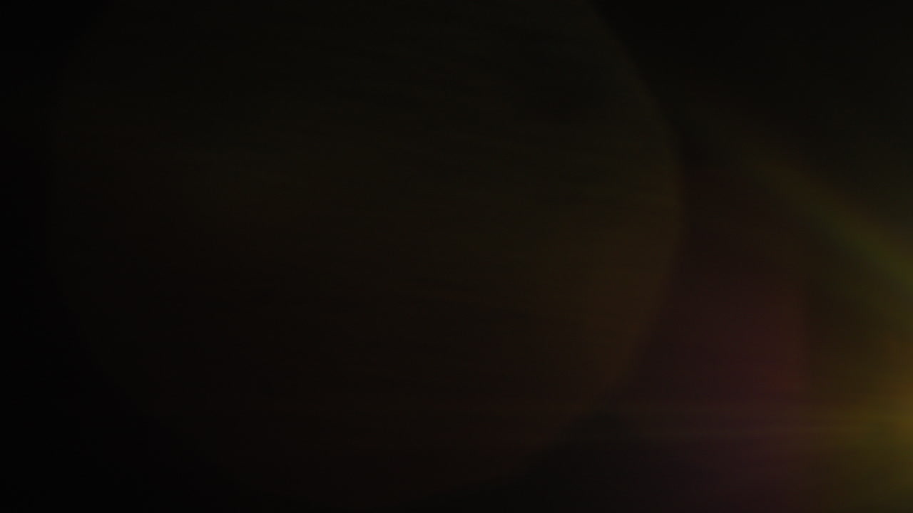 Real Lens Flare Effect Glowing Abstract Orange Background On Black