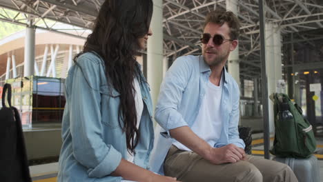 couple waiting at a train station