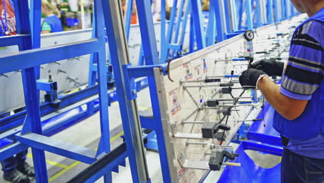 manufacturing of wiring harnesses. hands employee during manufacture the wiring