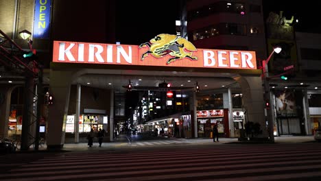 illuminated sign above city nightlife scene