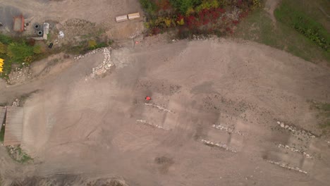 mtb-bike-park-rider-going-through-jumps-bird-eye-view-fall-color