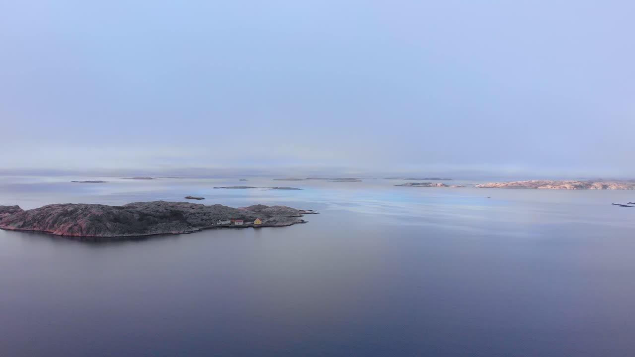 The Stunning Scenery of A Tropical Island in Lysekil, Sweden Surrounded By Depth Ocean During Sunset - Wide Shot