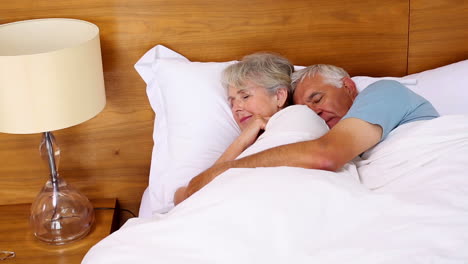 Senior-couple-sleeping-in-bed