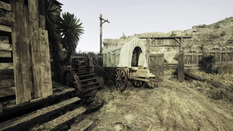 old western town with rustic wagon and weathered wooden structures