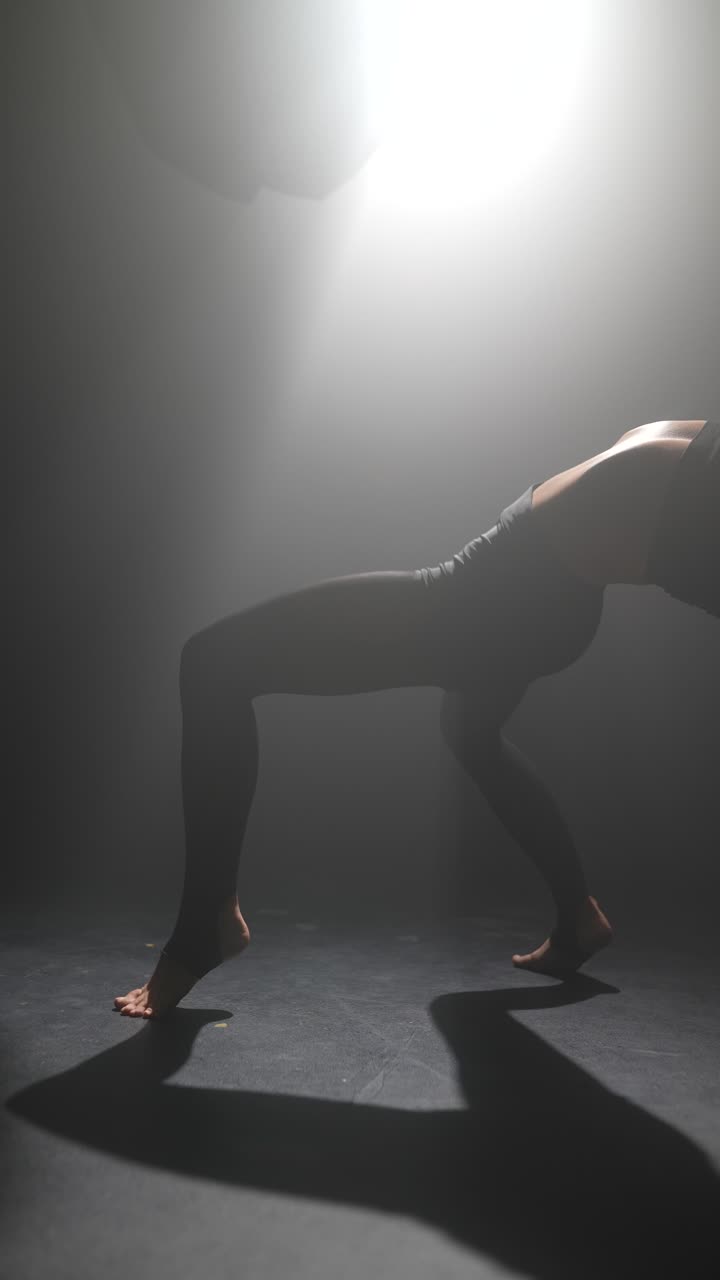 Modern Dance Performance in a Smoky Studio
