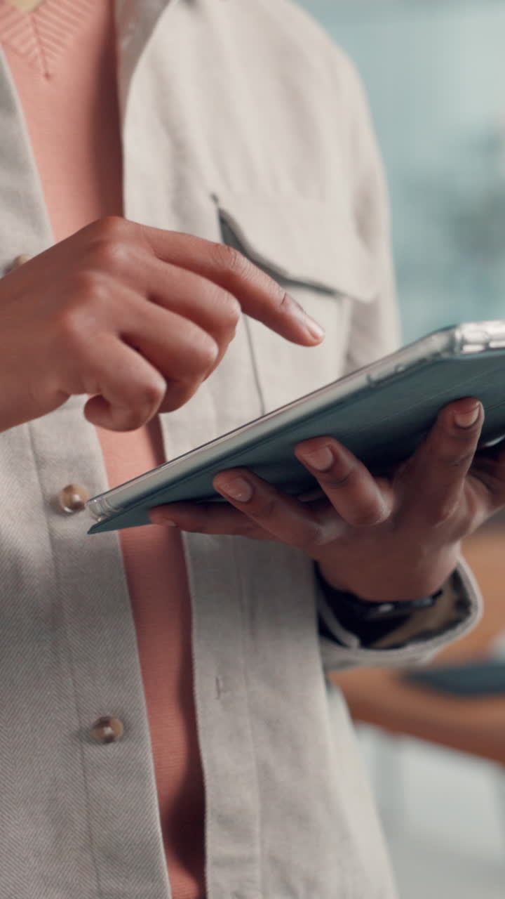 Close Up of Hands Touching and Swiping on a Digital Tablet