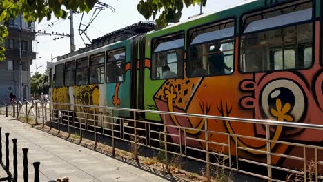 colorful graffiti tram in the city