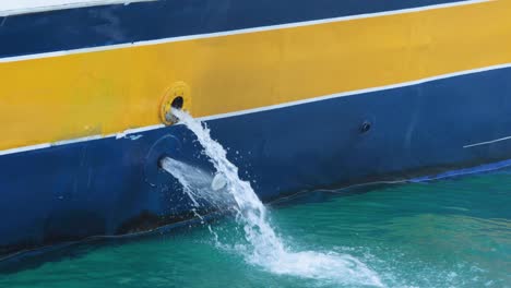 water draining from boat into the sea