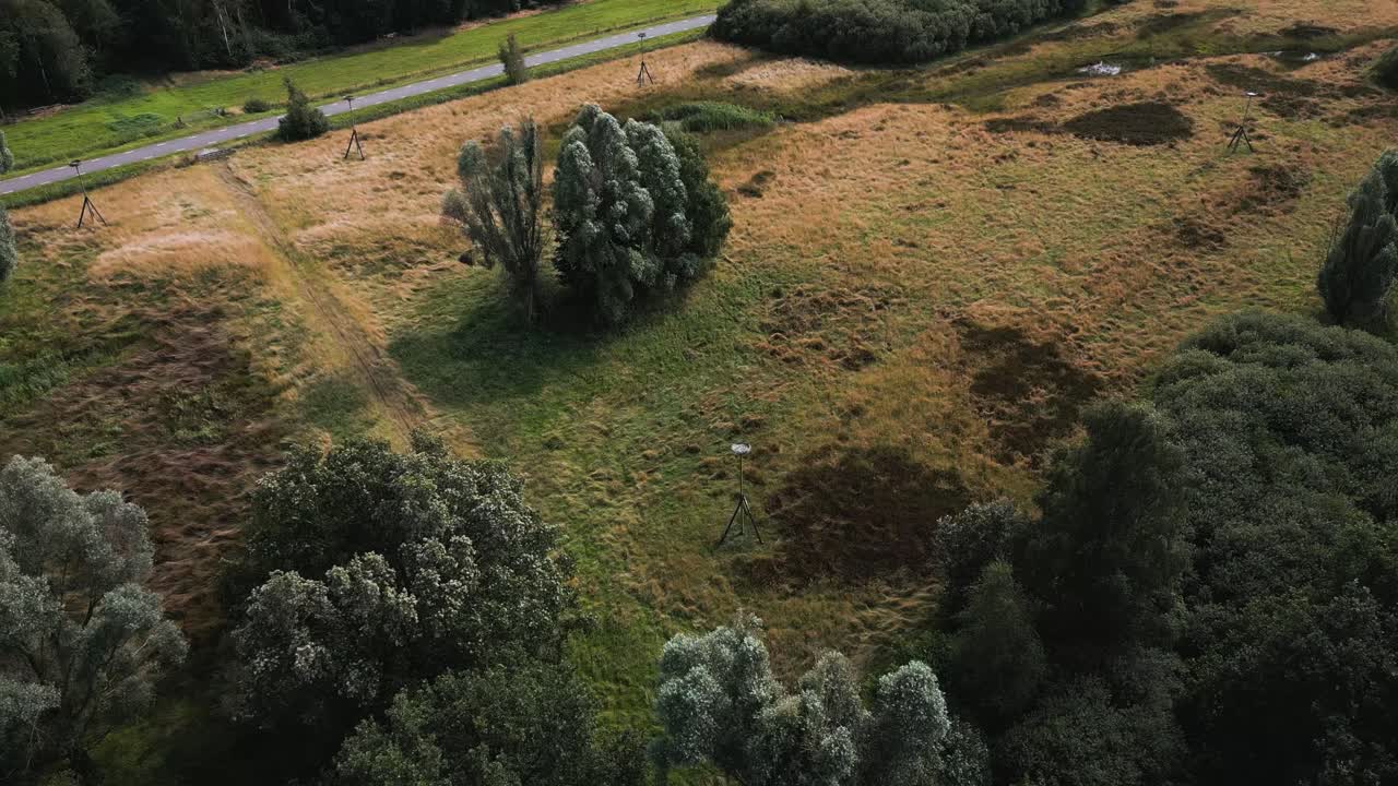 Aerial View of Rural Landscape with Road and Wetlands