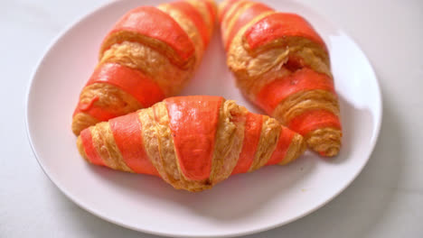 fresh-croissant-with-strawberry-jam-sauce-on-plate