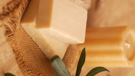 natural soap and candles on burlap