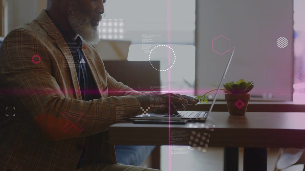 Senior man typing on laptop and tapping trackpad, generating pink geometric overlays for marketing