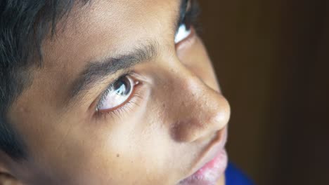 Detail-shot-of-boy-eyes-looking-up-,