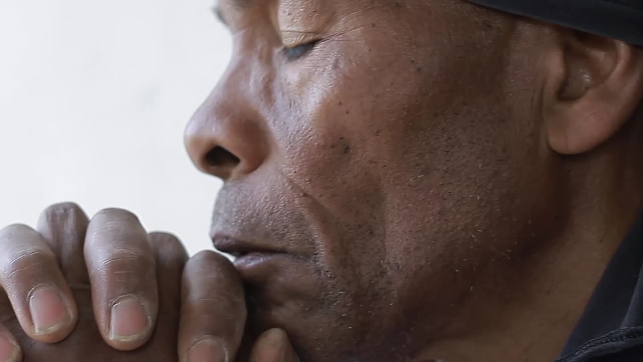 praying to God with hand's together with people and black background stock video stock footage