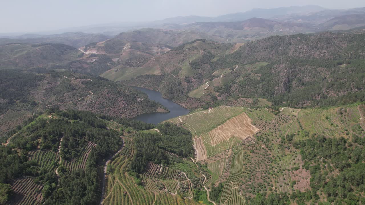 Aerial view of Tua River winding between forested hills