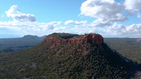 Drone-aerial-wide-circling-shot-of-Bears-Ears-west-peak-butte-in-Bears-Ears-National-Monument,-Utah