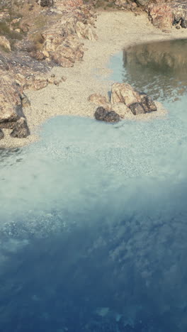 calm lake with rocky shore