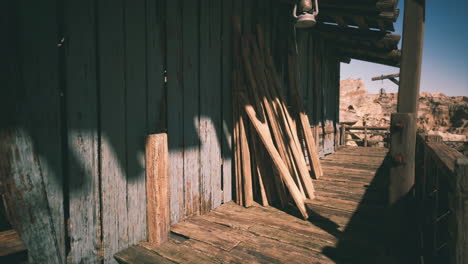 a weathered wooden cabin in the desert