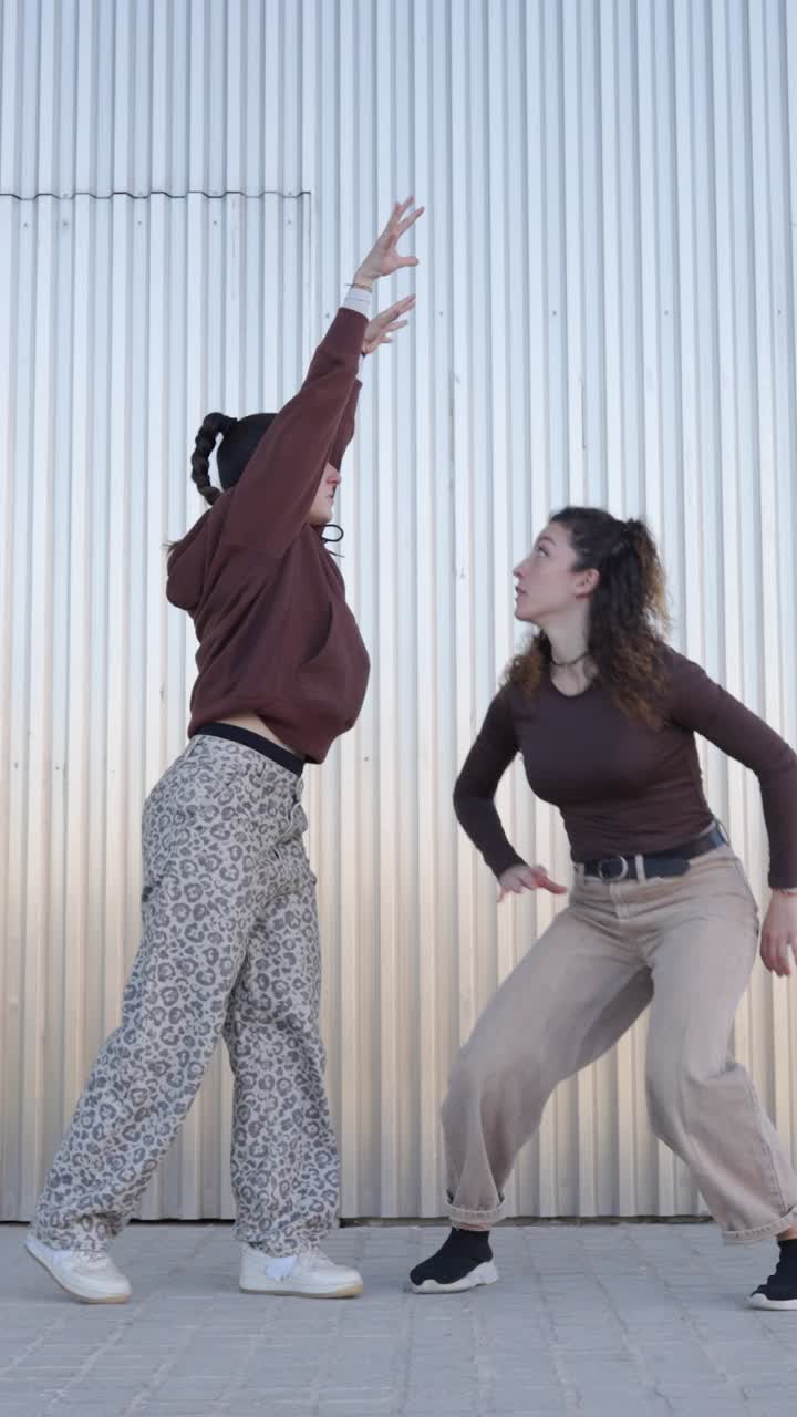 Urban female dancers performing energetic choreography