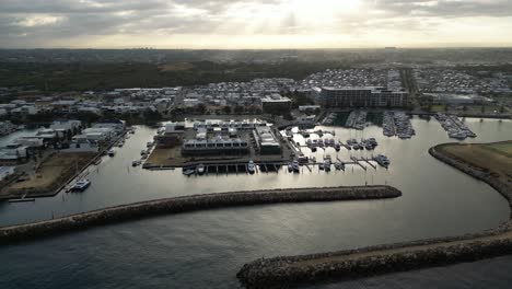 Docked-boats-at-the-harbor,-dynamic-aerial