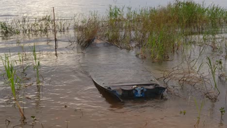 Lonely-Sinked-Boat-Flooded-at-the-Swamp-Water-of-the-Amazon-Rainforest,-Tropical-Landscape,-Static-Shot