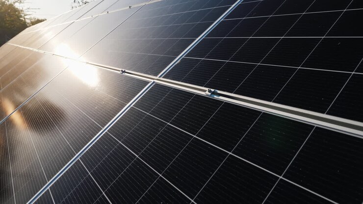 The Sun Reflects On The Surface Of Solar Panels