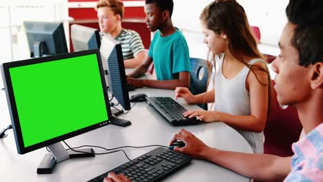 student working on computer in classroom