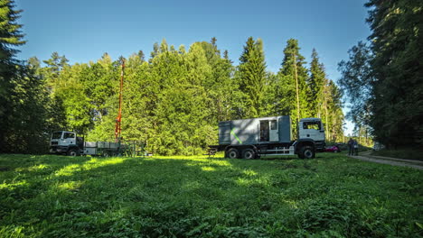 Static-shot-of-production-engineers-checking-the-gas-pipe-after-arriving-in-maintenance-trucks-at-daytime