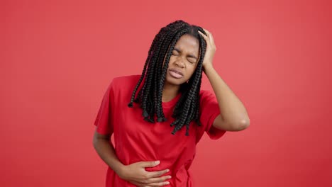 woman with headache and stomach ache